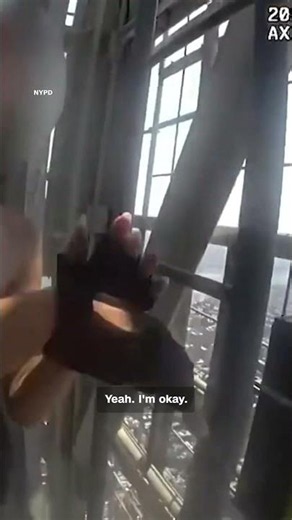 See officer’s POV as he climbs up Empire State Building to capture climbers