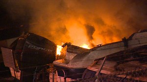 Stray fireworks ignite blaze that destroys 14 boats in Seattle