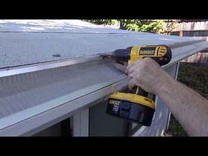Installing gutter guards on a flat roof by Gutterglove