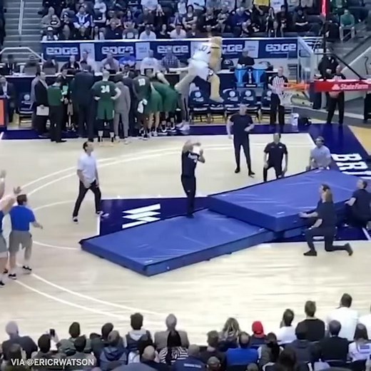 BYU's Cosmo the Cougar dunks from the 3 point line