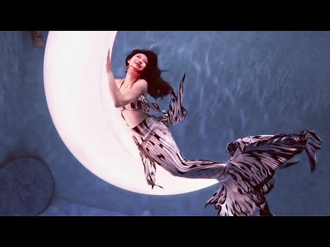 Beautiful mermaid relaxing swimming underwater