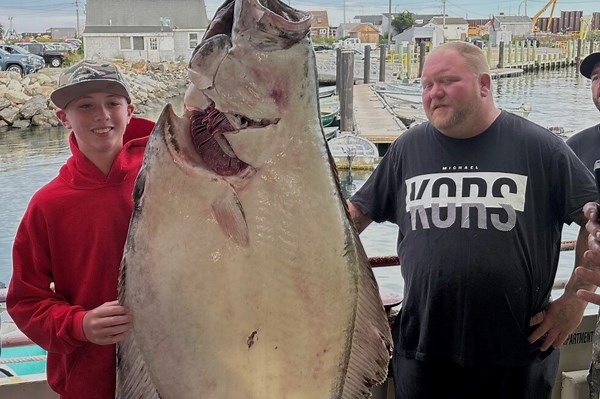 Young man and the sea: Teen fishing off New England coast catches huge halibut bigger than him