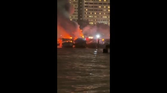 Three wooden ferries catch fire at bustling tourist spot in Thailand