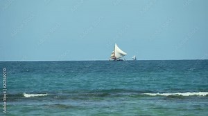 Traditional Haitian fishing boat in the Caribbean sea. Indigenous sailboat.