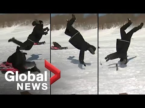 Reporter flipped by sled during news report [OFFICIAL VIDEO]