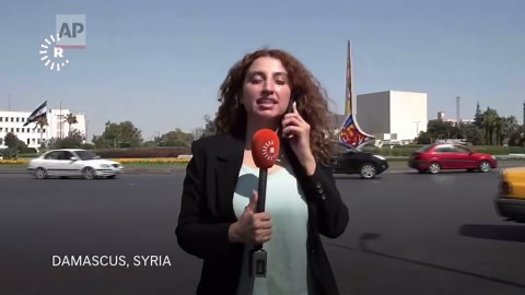 Reporter in Damascus reacts as Israeli strikes hit Syrian Defense Ministry behind her