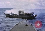 1945 – Pacific Ocean: An American submarine attacks a Japanese sampan underway in the Pacific Ocean.