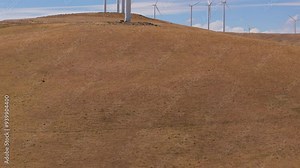 Goldendale, WA Wind Farm, Columbia River Gorge National Scenic Area: Aerial Drone view of the Wind Turbines at Goldendale, Washington. Slow crane up ascending reveal a medium shot.