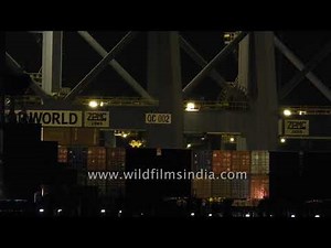 Loading cargo at night: Cargo container ship at Kochi harbour