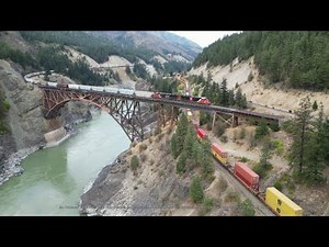 Simultaneous trains crossing the Fraser canyon at scenically stunning Cisco, British Columbia