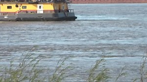 Search resumes Tuesday for 2 aboard capsized tugboat