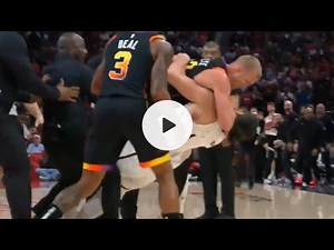 Steven Adams and Mason Plumlee wrestling each other to ground and both get ejected