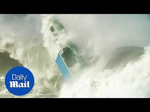 Dramatic moment tiny boat is capsized by huge wave in Indonesia