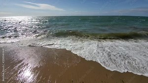 Ocean Water Waves under an Overlook Deck on the South Cape Beach in Cape Cod