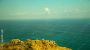 Ship sailing in the ocean. View from the Cliff. 4K. Time lapse