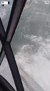 The Fastnet Lighthouse off County Cork provided a first row seat to the view of huge swells at sea off the Irish coast resulting from Storm Barra. Around 50,000 customers were without power in Ireland. https://abcn.ws/3pCFHKJ | ABC News