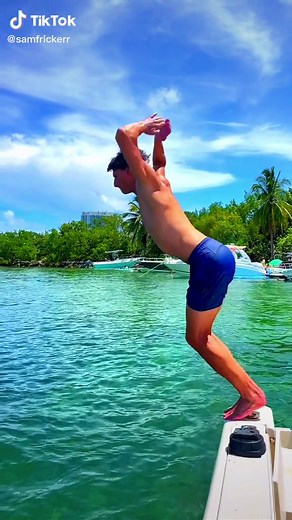 Exciting Backflip Dive from a Boat in Tropical Paradise
