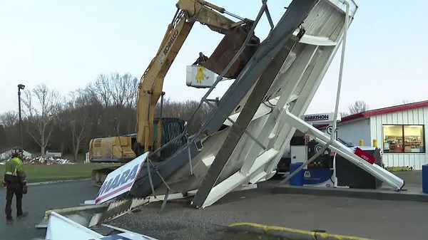 Wind damage: Gas station canopy topples; gazebo lands on home