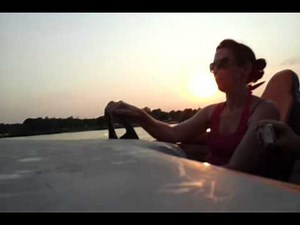 Hot girl driving speed boat