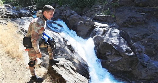 The river took a woman. A stranger dove in to try to bring her home