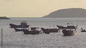 Vietnamese boats in a sea sunset. Blue hour. Nha Trang, Vietnam travel landscape and destinations.