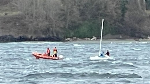 Washington ferry crew rescues capsized sailboat passengers