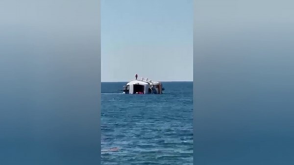 Brand new $1M luxury yacht tips over and sinks just minutes after launching — forcing crew to jump overboard