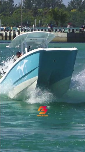 Riding the waves: Catamaran leaps and powers through heavy surf at Haulover Inlet
