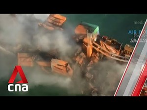 Sri Lanka faces environmental disaster as fire-hit cargo ship carrying tonnes of chemicals sinks