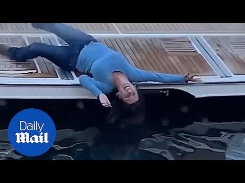 Drunk woman stumbles from docked boat into water in hilarious footage