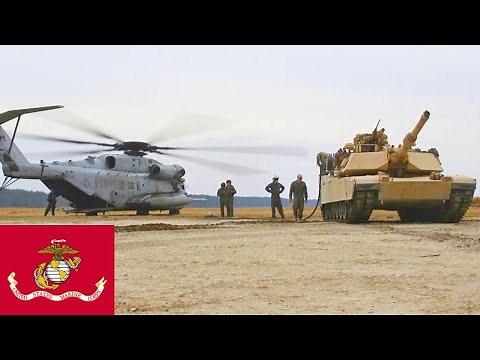 US Marines refueling M1A1 Abrams tanks using the CH-53E Super Stallion.