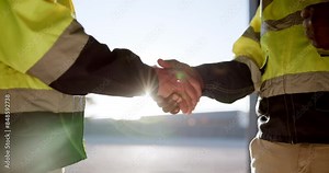 Handshake, architects or construction workers agree for partnership, teamwork or collaboration. People, support or community greeting together on site for inspection, maintenance or b2b communication