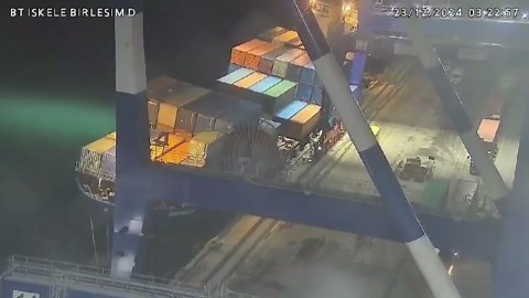 Cargo ship capsizes sending containers toppling into water