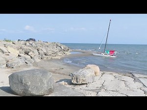 Couple rescued from capsized boat