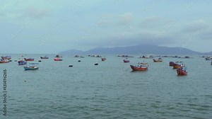Vietnamese boats in a sea sunset. Blue hour. Nha Trang, Vietnam travel landscape and destinations.